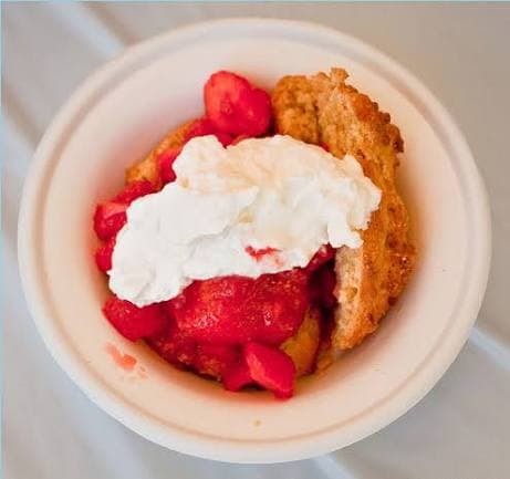 Bowl of strawberries topped with whipped cream Bowl of strawberries topped with whipped cream